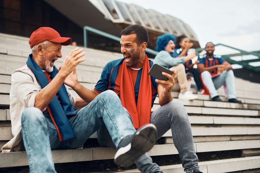 Men Cheering at Sports Event