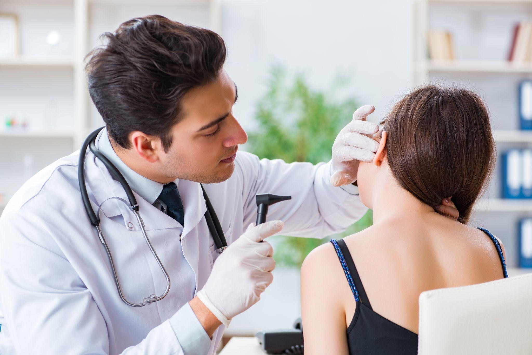 Doctor Treating Hearing Loss