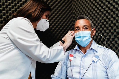 Beltone Doctor Treating Client