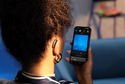 Beltone Envision Hearing Aid User with Phone